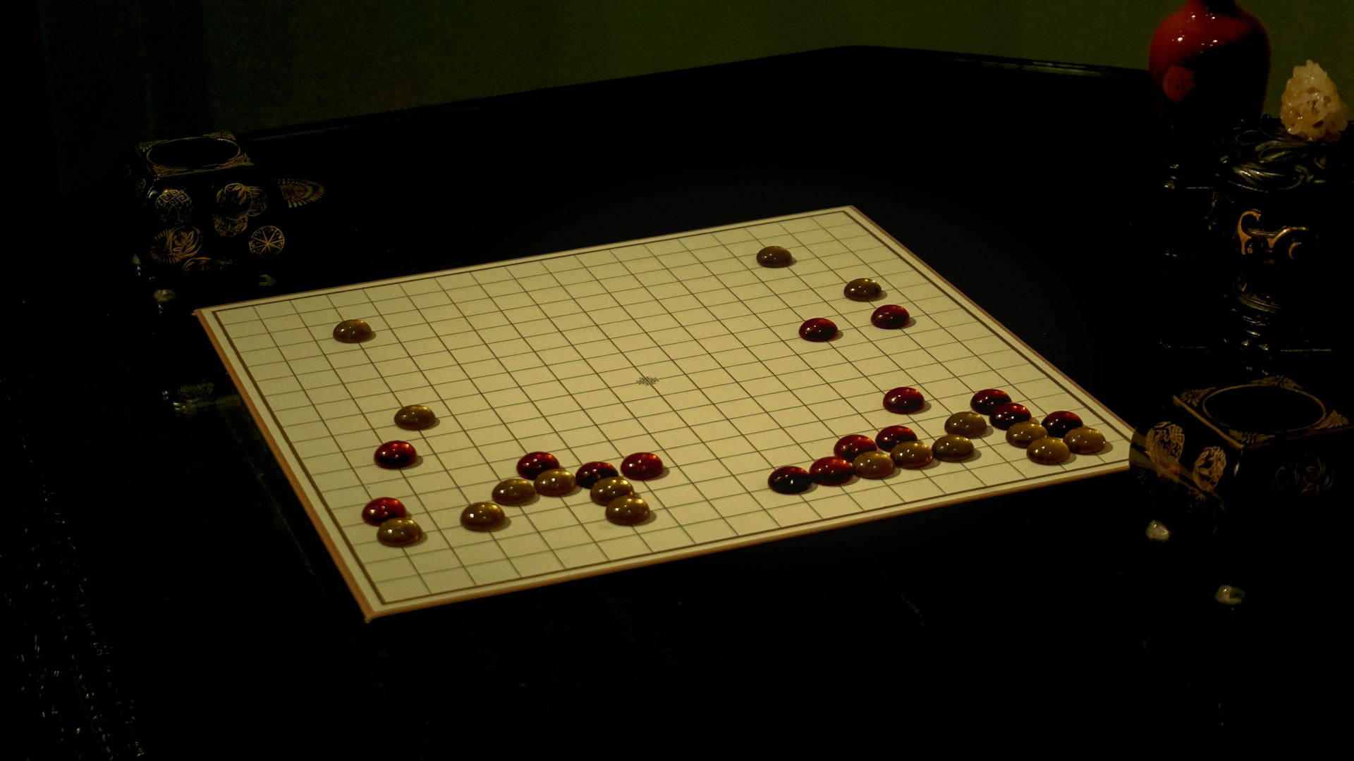A board game set up in a dark room